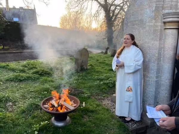 rebecca Rock by a fire