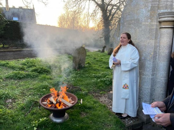 rebecca Rock by a fire