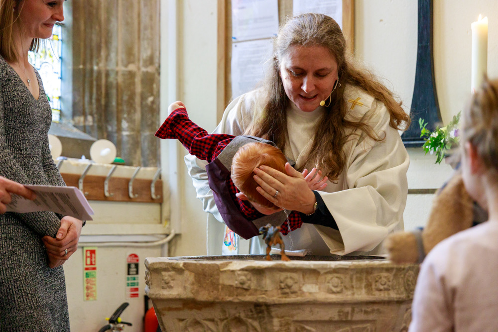 Rebecca Rock baptising an infant