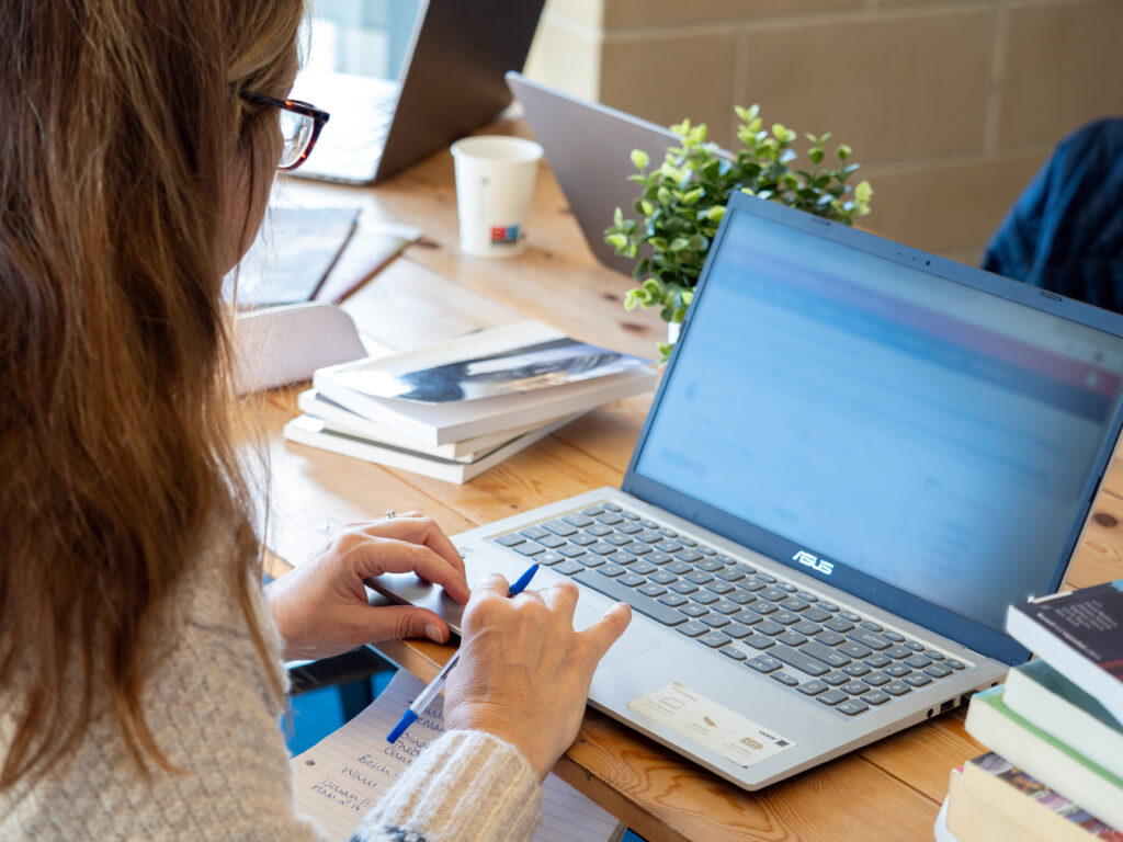 woman typing on laptop